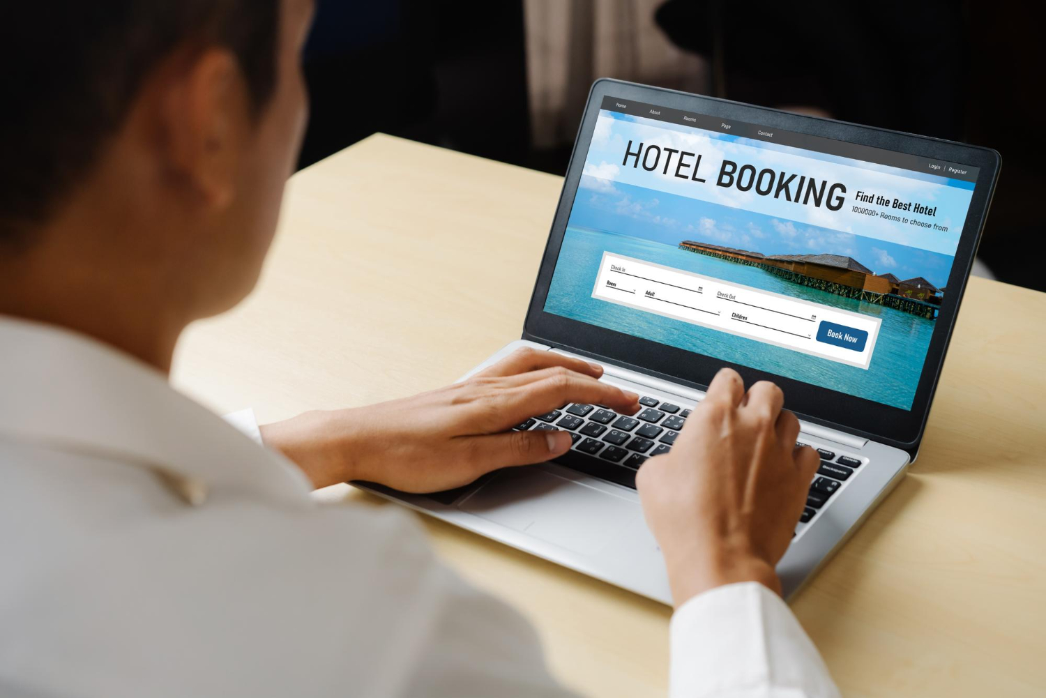 Man on laptop for hotel booking
