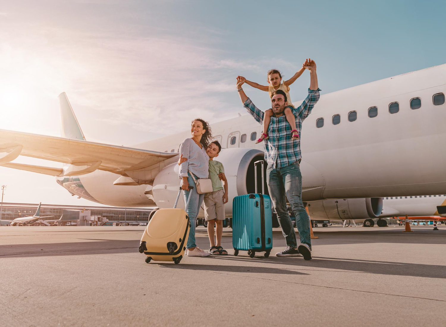 Family infront of a plane