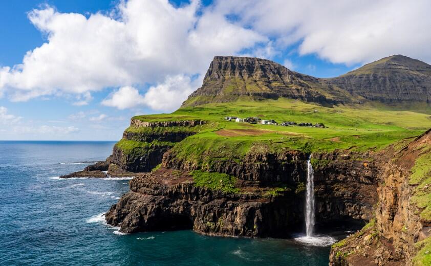 The Faroese village of 18 people that was only reachable on foot until 2004 — and the tunnel that changed everything