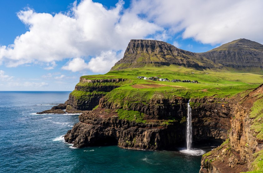 The Faroese village of 18 people that was only reachable on foot until 2004 — and the tunnel that changed everything