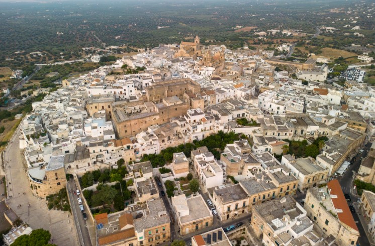 The Italian hilltop town painted entirely white by law since the 17th century plague