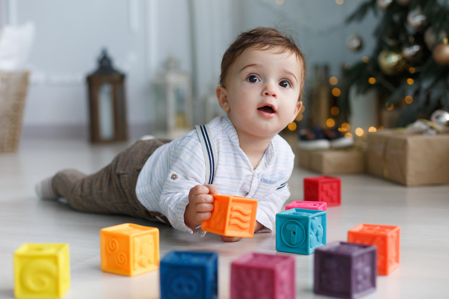 Baby playing blocks floor