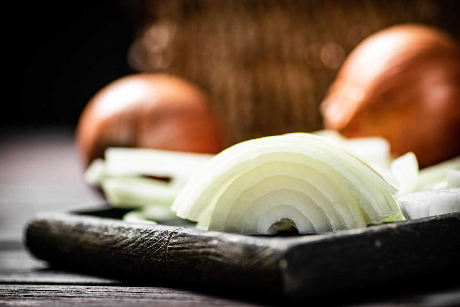 Sliced onion cutting board knife
