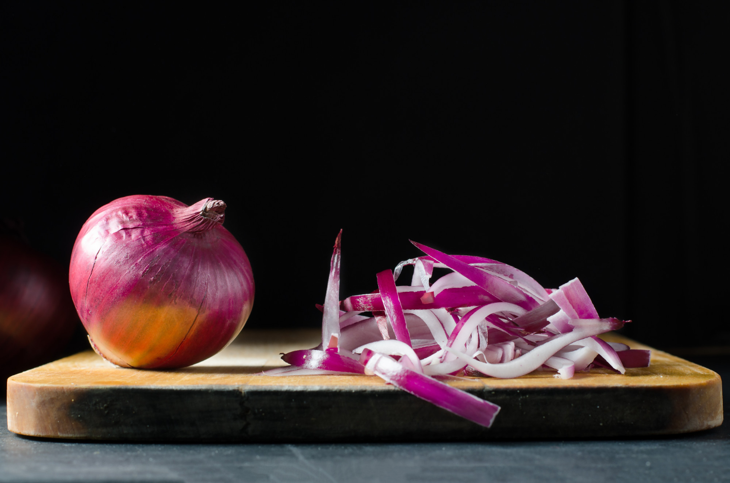 Sliced onion cutting board knife