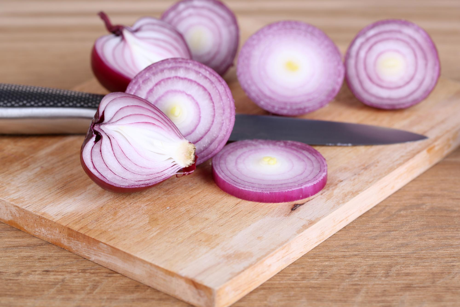 Sliced onion cutting board knife