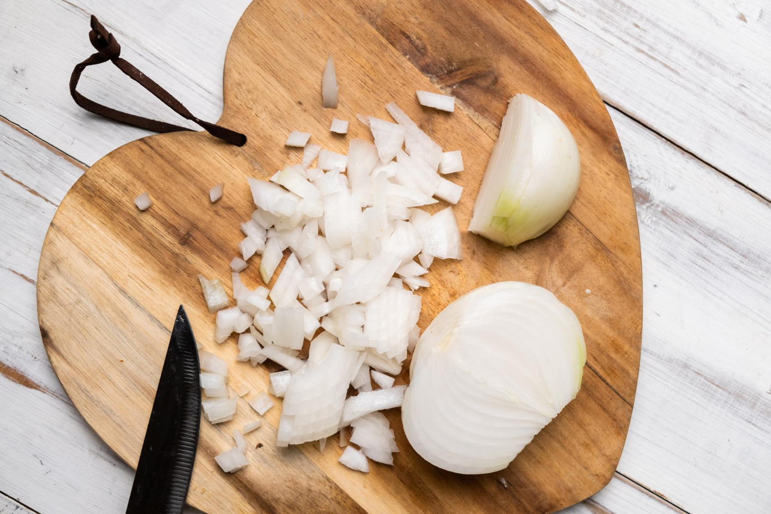 Sliced onion cutting board knife