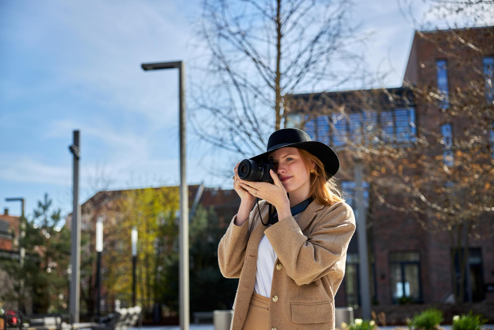 person photographing street