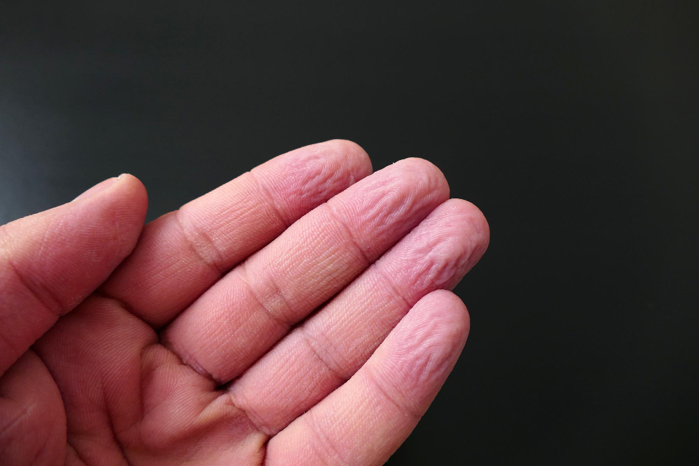 wrinkled fingers water