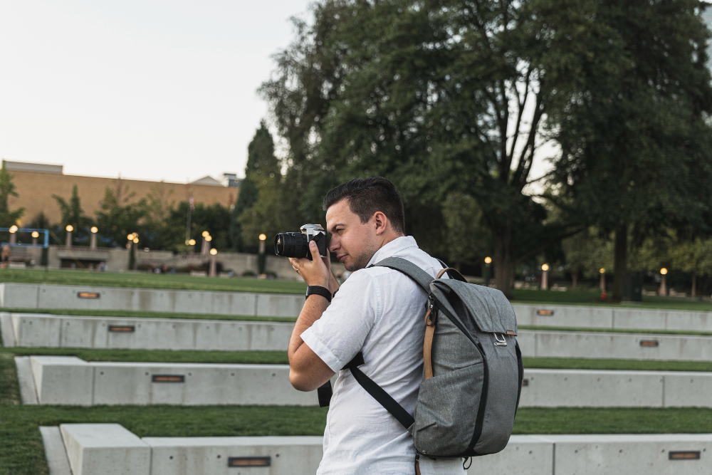 person photographing street