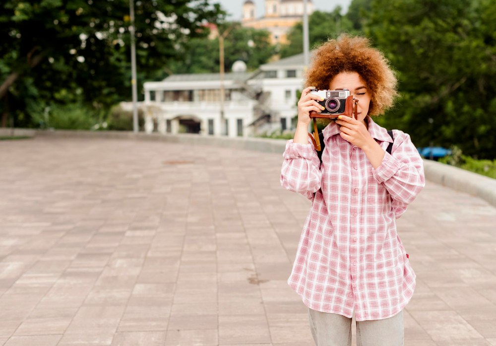 person photographing street