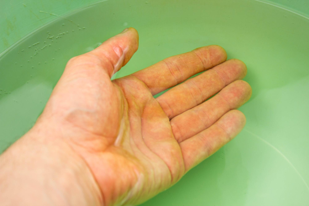wrinkled fingers water