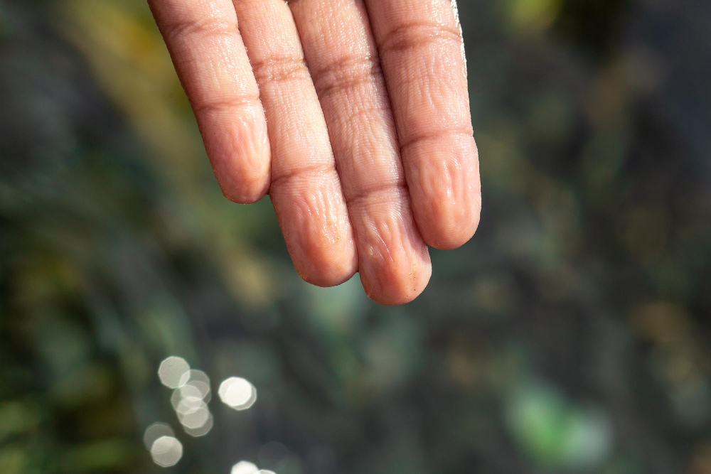 wrinkled fingers water