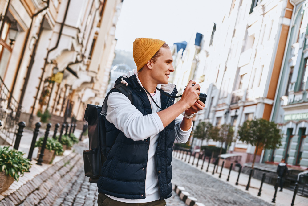 person photographing street